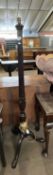 An early 20th Century mahogany standard lamp raised on tripod base, 152cm high excluding fittings