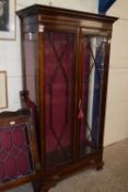 A 20th Century Sheraton style display cabinet, the mahogany body with moulded and dentel cornice,