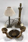 A brass table lamp with corinthian column together with a wall lamp with a brass shell design and