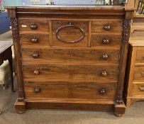 A Victorian mahogany scotch chest, the body with four short drawers, a central deep bonnet drawer
