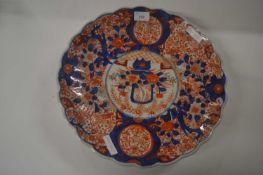 A Japanese porcelain charger Meiji period, decorated in Imari style, 37cm diameter