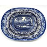 A mid 19th Century pearl ware dish printed with a pastoral landscape and floral border together with