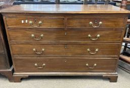 A George III mahogany chest of two short over three long drawers, fitted with brass swan neck