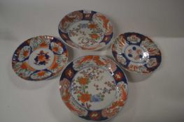 Group of four Japanese porcelain dishes Meiji period, two with floral designs and a further two with