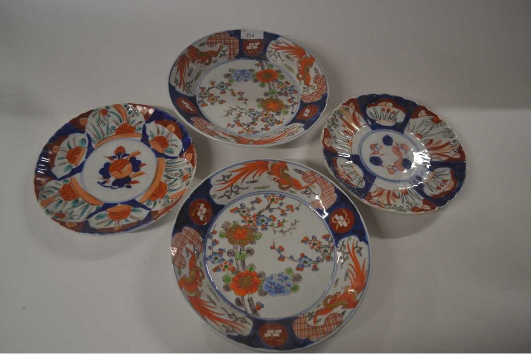 Group of four Japanese porcelain dishes Meiji period, two with floral designs and a further two with - Image 1 of 3