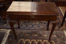 A Georgian mahogany combination three leaf games and tea table, raised on cabriole legs with pad