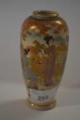 A small Japanese Satsuma vase decorated with figures in a landscape with Mount Fuji in the