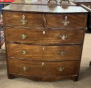 A late Georgian mahogany chest of two short over three long drawers fitted with brass handles,