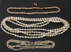 A quantity of costume pearls, to include a three strand rice pearl necklace with clasp stamped