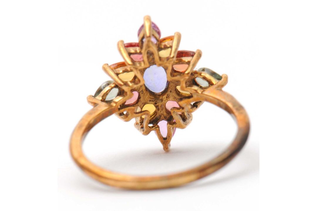 A 9ct multi gemset ring, set with oval and pear shape sapphires, topaz and quartz, with plain band - Image 4 of 7