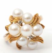 A 9ct cultured pearl ring, the cultured pearl cluster with diamond highlights, with plain band