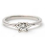 A platinum diamond ring, with round brilliant cut diamond, 0.33cts, with plain band stamped 950,