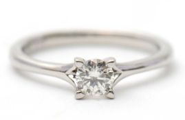 A platinum diamond ring, with round brilliant cut diamond, 0.33cts, with plain band stamped 950,