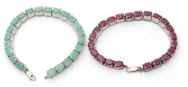 Two gemset bracelets, one set with oval rubies and the other set with oval green stones, possibly