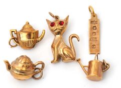 Five assorted hallmarked 9ct charms, 4.9g