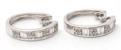 A pair of 18ct diamond earrings, the hinged hoops a third set with round brilliant and baguette
