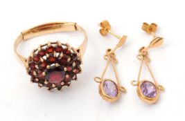 A 9ct garnet cluster ring, with plain band stamped 375 with Birmingham assay mark (year worn),