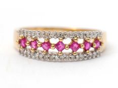 A 9ct ruby and diamond ring, with central row of square cut rubies with a row of diamond