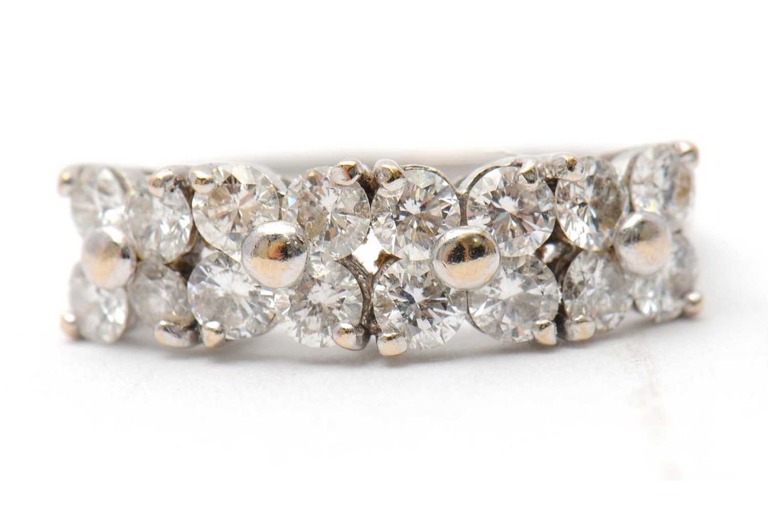 An 18ct diamond ring, set with round brilliant cut diamonds, total estimated approx. 0.36cts, with - Image 2 of 8