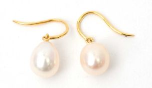 A pair of cultured pearl earrings, the oval cultured pearls approx. 8.5g diameter, on hooks