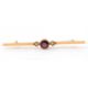 A garnet and seed pearl bar brooch, with central round garnet in millegrain collet mount, with a - Image 1 of 3