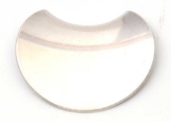 Nanna Ditzel for Georg Jensen: the crescent moon shaped disc brooch with lightly curled edge,