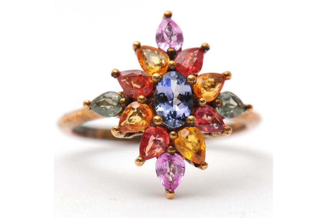 A 9ct multi gemset ring, set with oval and pear shape sapphires, topaz and quartz, with plain band - Image 5 of 7