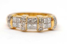 An 18ct diamond ring, set with round brilliant and princess cut diamonds, total estimated approx.