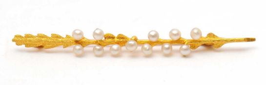 A 15ct seed pearl brooch, the brooch modelled as a floral blade with white seed pearls, stamped 15ct