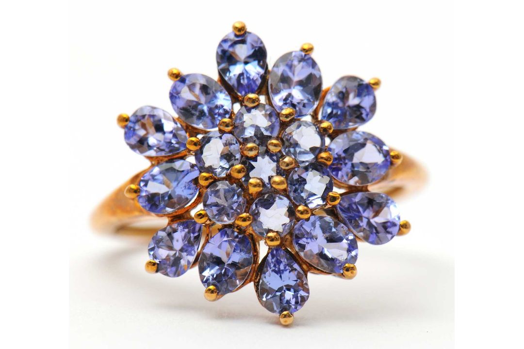 A 9ct tanzanite cluster ring, the cluster formed of round, oval and pear shape tanzanites, with - Image 6 of 7