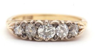 An 18ct five stone diamond ring, the five graduated old mine cut diamonds, total estimated approx.