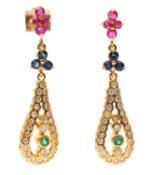 A pair of multi gemset earrings: with trio's of rubies and sapphires, with a pear shape frame