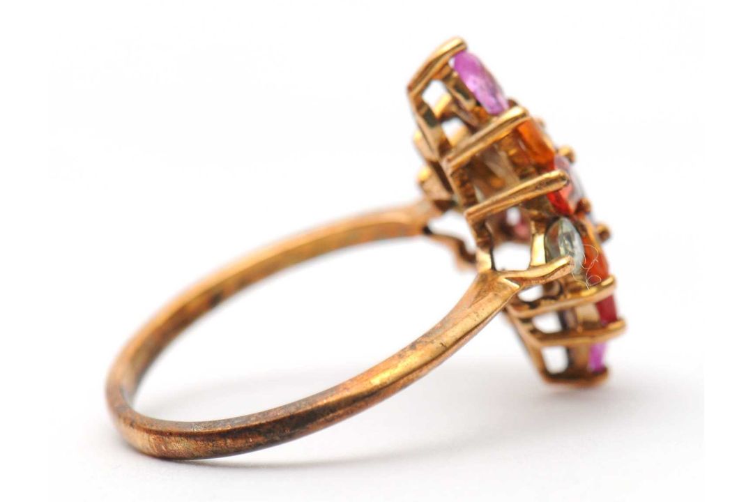 A 9ct multi gemset ring, set with oval and pear shape sapphires, topaz and quartz, with plain band - Image 2 of 7