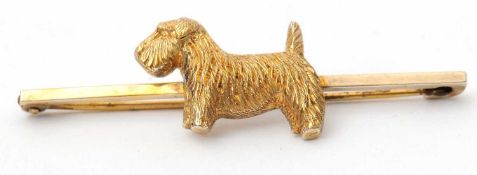A silver gilt terrier brooch, the naturallistically modelled terrier set to a plain bar,