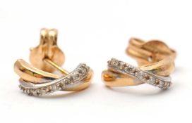 A pair of unmarked bi-colour metal and white stone crossover earrings, 10mm long, 0.77g