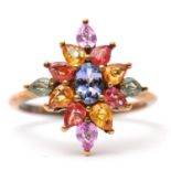 A 9ct multi gemset ring, set with oval and pear shape sapphires, topaz and quartz, with plain band