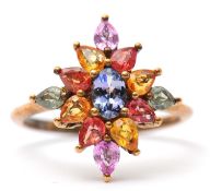 A 9ct multi gemset ring, set with oval and pear shape sapphires, topaz and quartz, with plain band