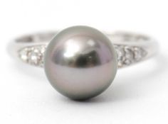 A 9ct pearl and diamond ring, the Tahitian cultured pearl, approx. 9mm diameter, with diamond
