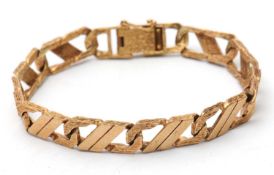 A 9ct curblink bracelet, with smooth and textured links, stamped 375 and hallmarked London 1991,