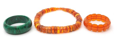 An amber bead necklace, with irregular disc shape beads, 48cm long, 90.g; an amber bead bracelet,