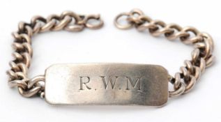 A Georg Jensen silver identity bracelet, the silver curblink bracelet with central initialled