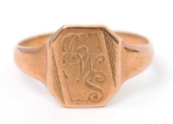 A 9ct signet ring, with central initialled panel, tapered shoulders and plain band hallmarked