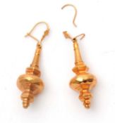 A pair of gold earrings, the unmarked moulded tapered hollow drops, 40mm long, with hooks stamped