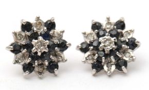 A pair of 9ct sapphire and diamond earstuds, 11mm diameter, 1.8g
