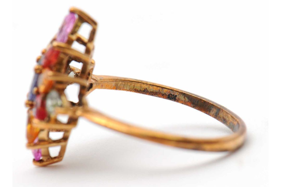 A 9ct multi gemset ring, set with oval and pear shape sapphires, topaz and quartz, with plain band - Image 7 of 7