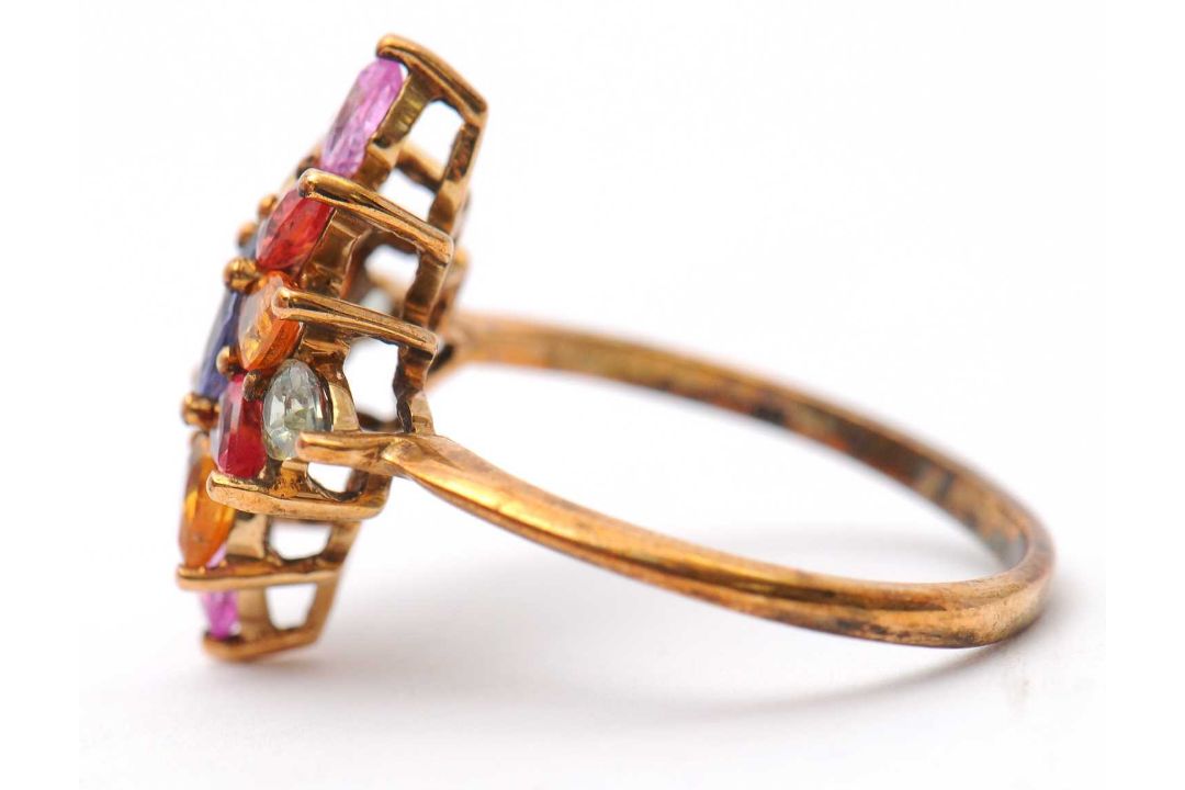A 9ct multi gemset ring, set with oval and pear shape sapphires, topaz and quartz, with plain band - Image 6 of 7