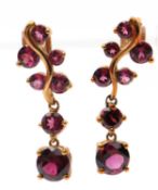 A pair of 9ct garnet earrings, set with round garnets and two larger graduated round garnet drops,