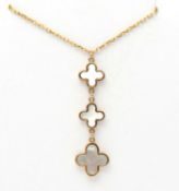A 9ct mother-of-pearl pendant necklace, set with four graduated collet set mother-of-pearl