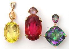 Three 9ct gemset pendants: to include an oval rubelite and amethyst pendant stamped 375 with