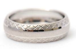 A 9ct white gold ring, 8mm wide, hallmarked Birmingham 2006, size N, 1.2g